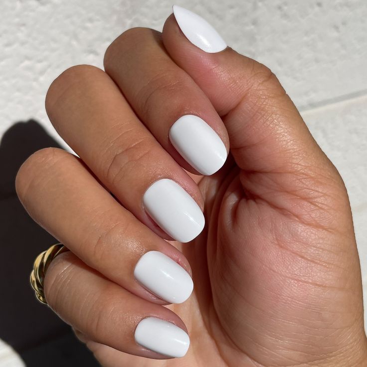 Elegant Classic White Manicure: Versatile and Sophisticated for Any Occasion.