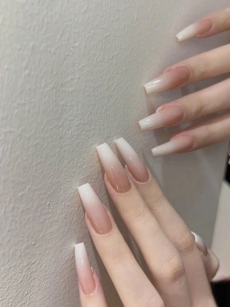 Elegant Ombre Nail Design: Smooth Nude to Creamy White Transition with Modern Square Shape.