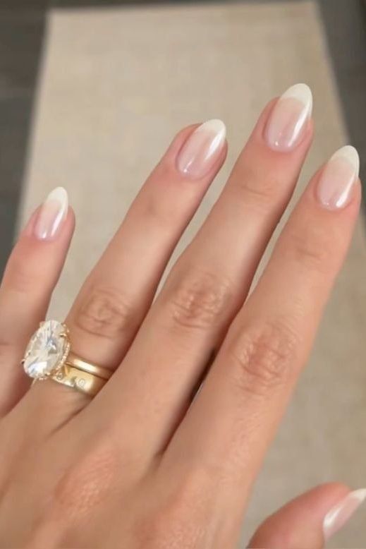 Timeless Elegance: Chic French Tip Nail Design with Ombre Transition and Glossy Finish.