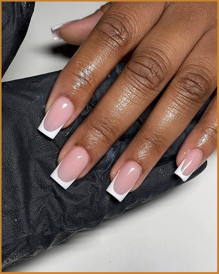 Sophisticated French Manicure: Timeless Elegance with Soft Pink and Crisp White Tips.