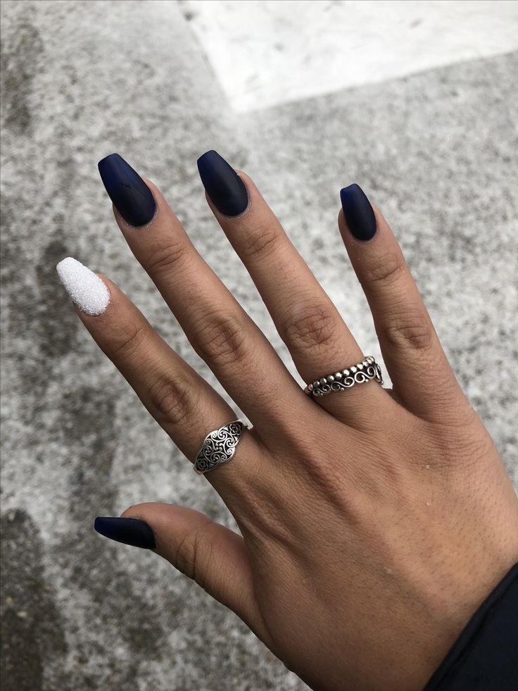 Sophisticated Nail Design: Deep Navy Matte with Glittering White Accent and Elegant Rings