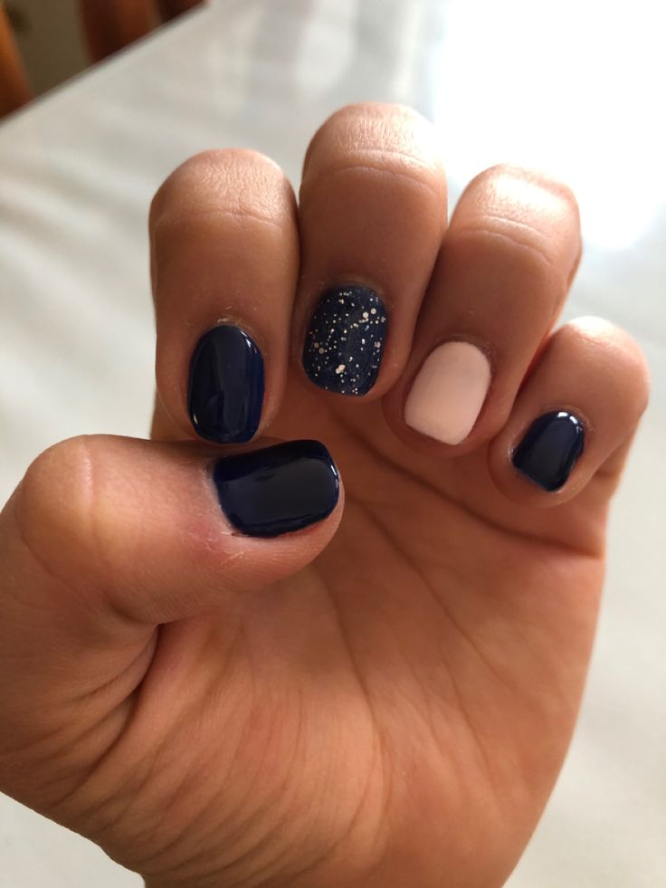 Chic Multi-Textured Nail Design with Dark Navy Base and Sparkling Accents