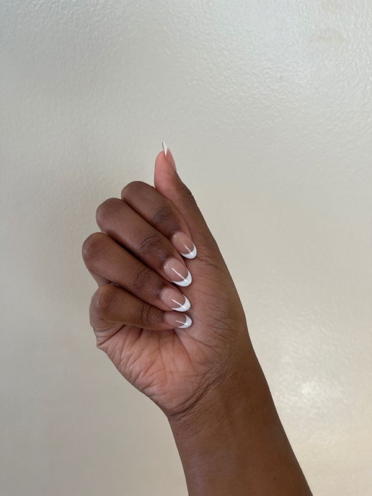 Sophisticated Twist on Classic French Manicure with Elegant Nude Base and Delicate White Tips.