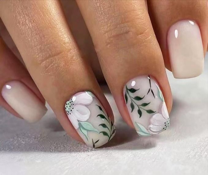 Elegant Floral Nail Design with Delicate Hand-Painted Blooms in Soft Hues.