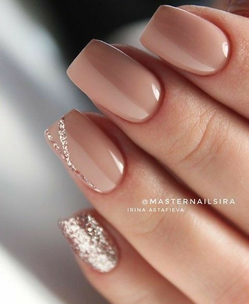 Chic Nude Nail Design with Elegant Glitter Accents.