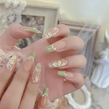 Delicate Floral Nail Design in Soft Green: Elegant Art with Intricate White Flowers and Mint Tips