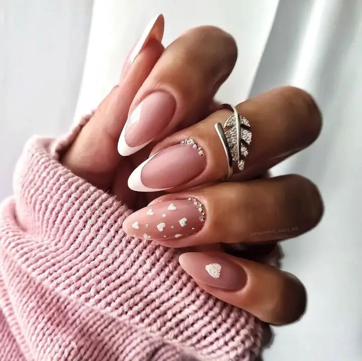 Elegant Soft Pink Nail Design with Heart and Gemstone Accents