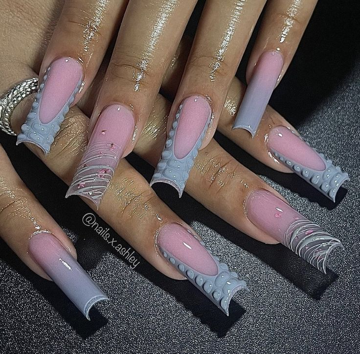 Chic Nail Art: Soft Pink and Light Gray Design with Intricate Textures and Playful Patterns.