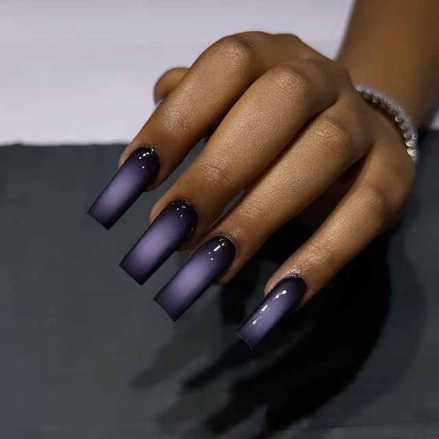 Sophisticated Ombre Nail Design: Deep Purple to Light with Glossy Cuticles and Matte Finish.