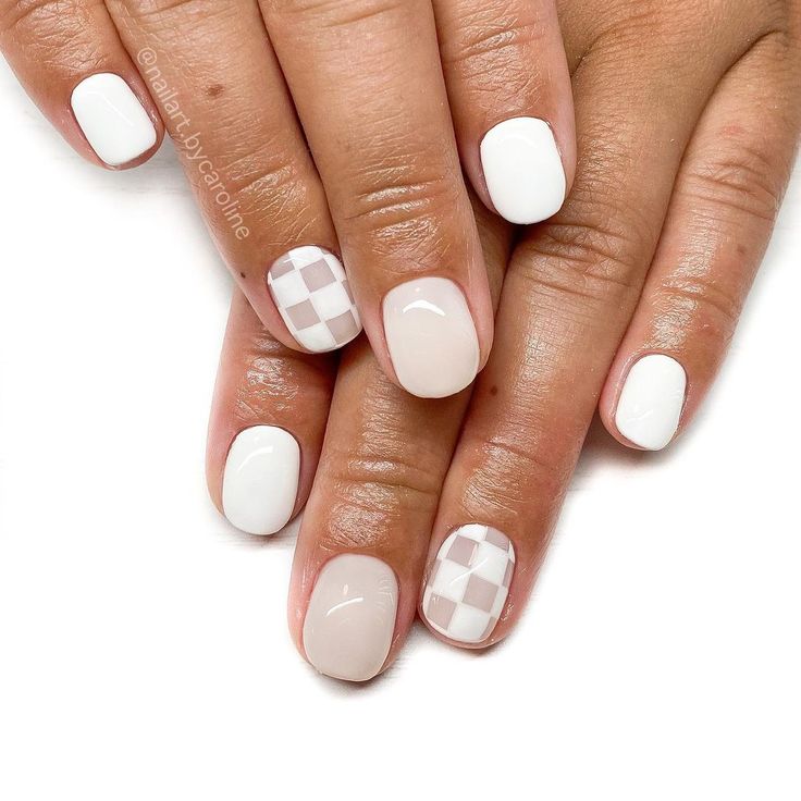 Chic White Nail Design: A Playful Mix of Solid and Checkered Patterns for Modern Elegance.