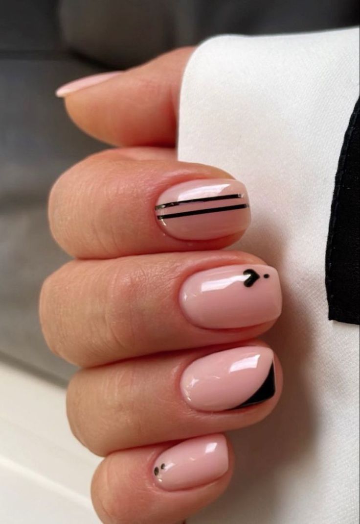 Elegant Geometric Nail Design with Soft Pink Base and Minimalist Black Accents.