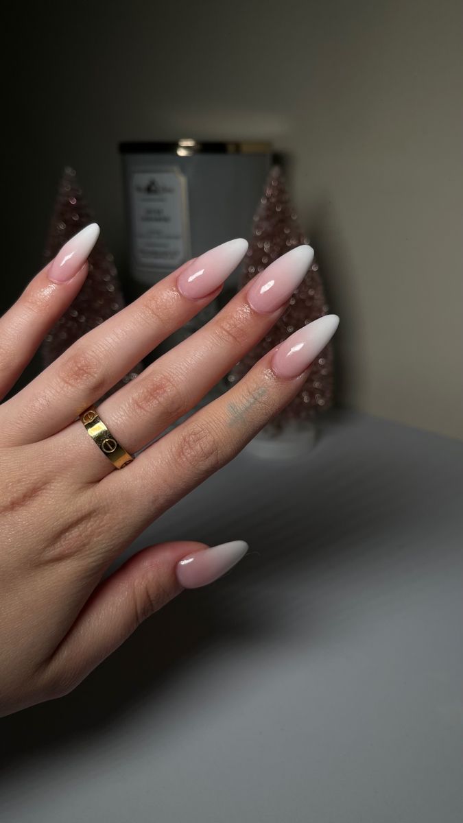 Chic Ombre Almond Nails with Glossy Finish and Gold Ring Accents.