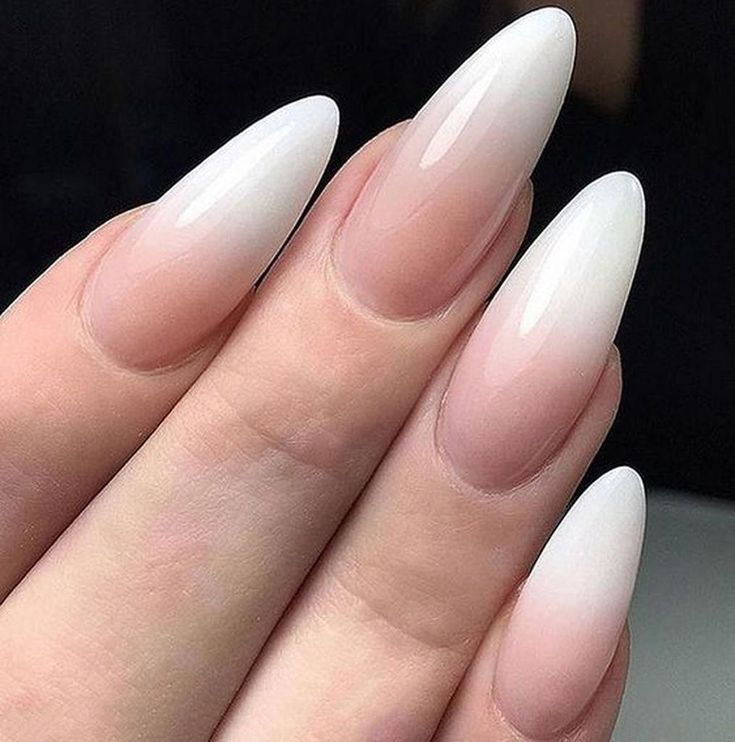 Elegant Ombre Almond-Shaped Nails: A Chic Nude-to-White Gradient.