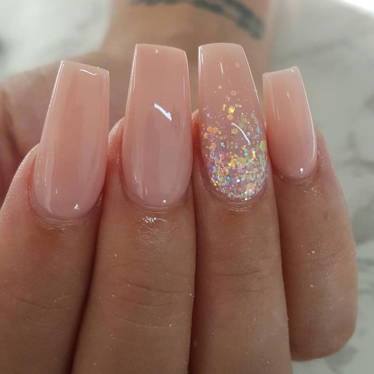 Chic Glossy Nude Nails with Iridescent Glitter Accent for a Sophisticated Look.