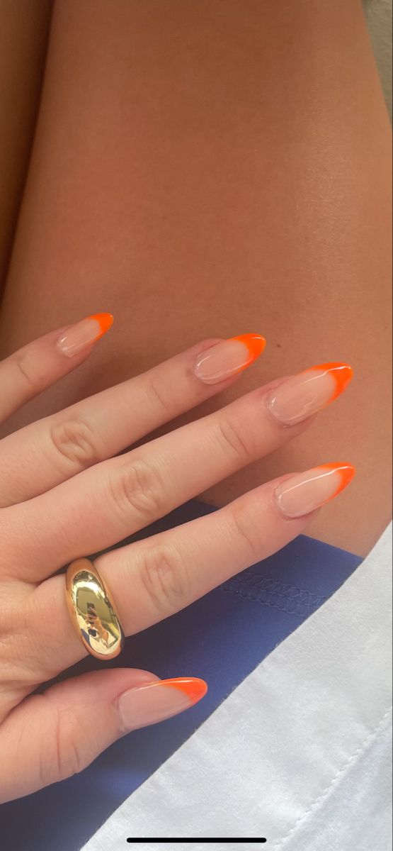 Playful Chic: Bright Orange-Tipped Nail Design with Clear Base