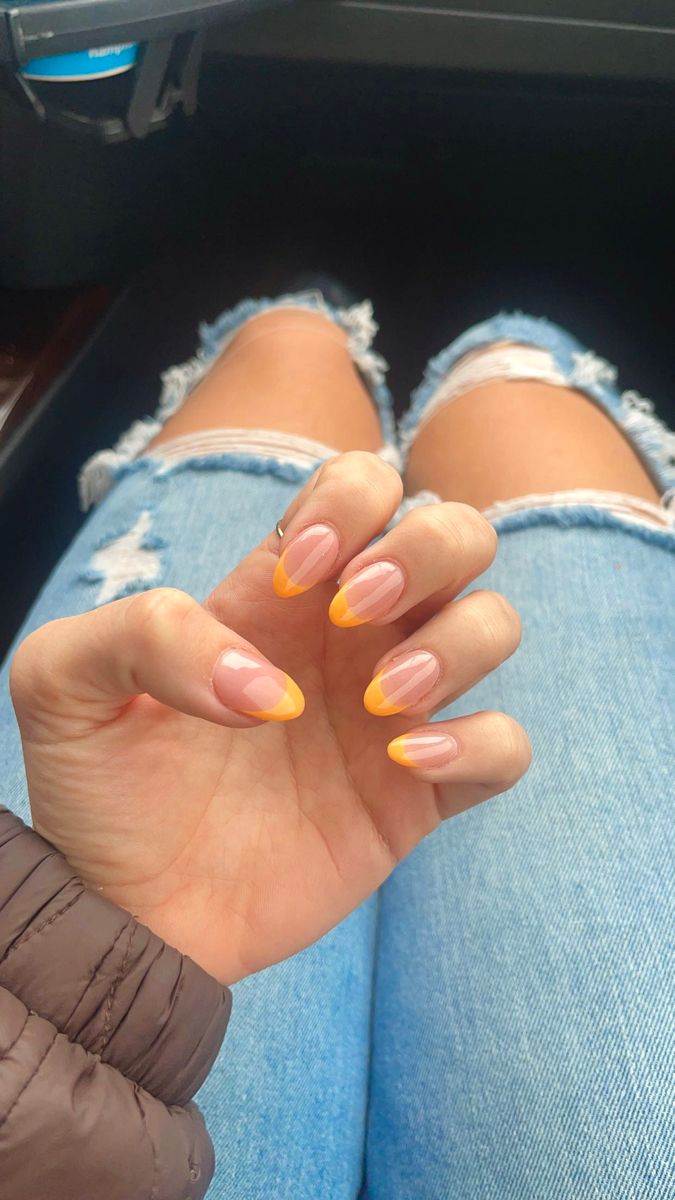 Chic Nude and Bright Yellow Tip Nail Design: A Stylish Spring/Summer Statement.