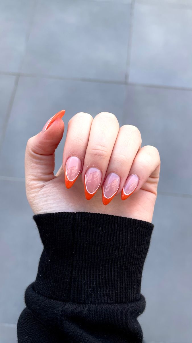 Chic Modern Nail Design: Soft Nude Base with Vibrant Orange Tips