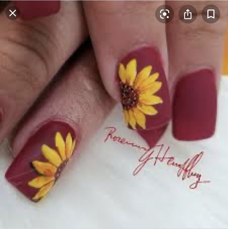 Vibrant Deep Maroon Nails Adorned with Cheerful Sunflower Artwork for a Stunning Seasonal Look.