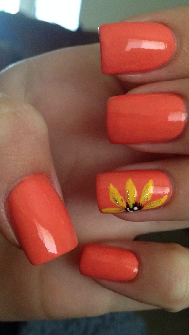 Vibrant Coral Nail Design with Playful Floral Motif for a Cheerful Summer Look.