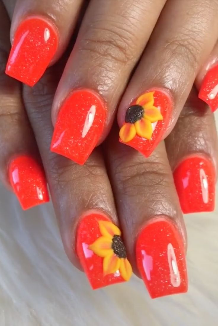 Cheerful Summer Nail Design: Glossy Orange with Sunflower Accent