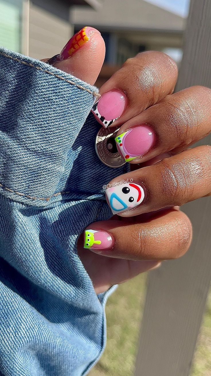 Vibrant Playful Nail Designs with Whimsical Characters and Patterns.