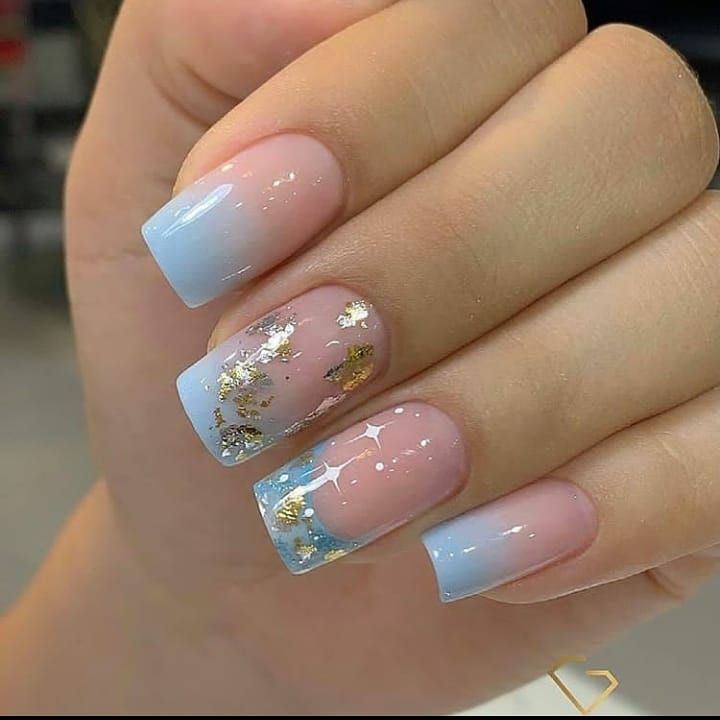 Chic Gradient Nail Design with Gold Foil Accents in Blue and Pink.