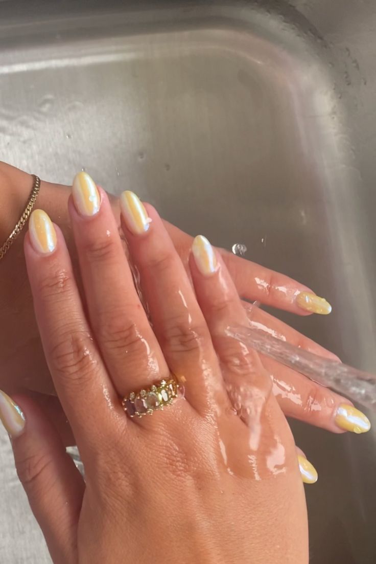 Glossy Yellow Almond-Shaped Nails: Playful Summer Vibes with a Trendy Twist.