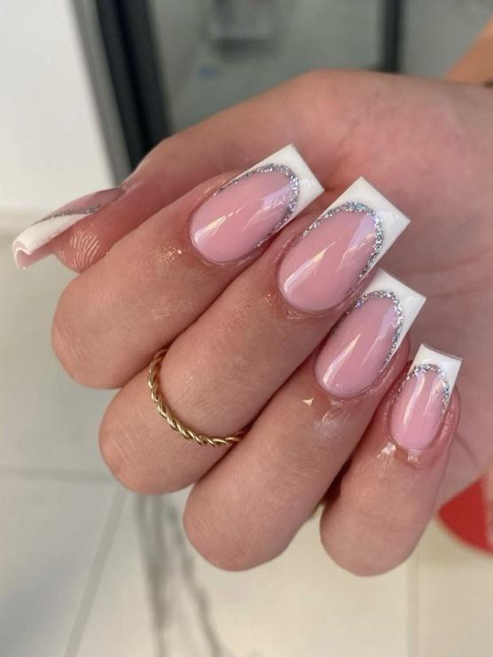 Sophisticated Classic Pink French Tip Nail Design with Delicate Silver Accents.