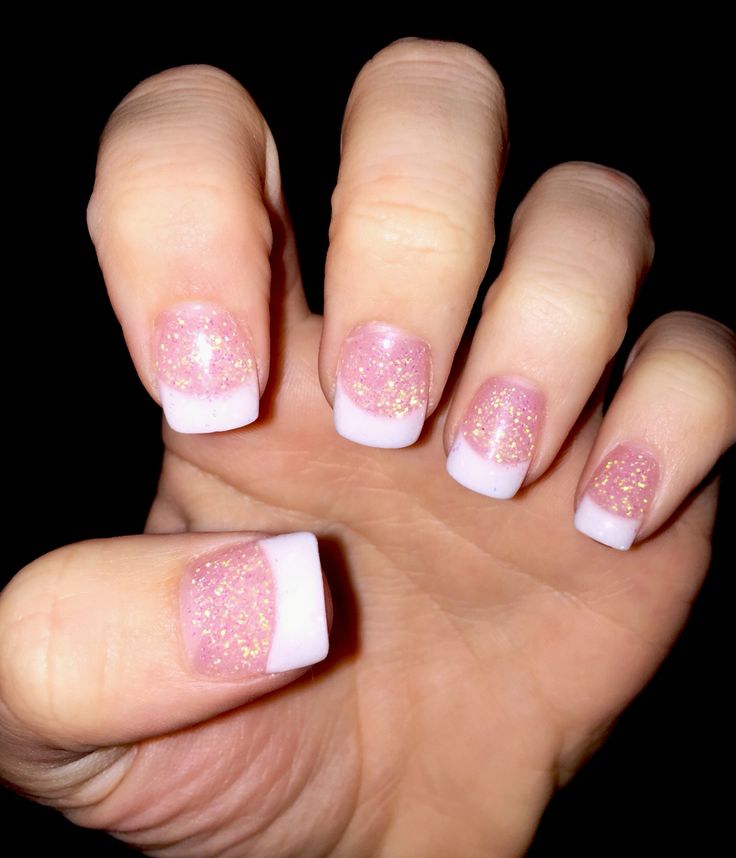 Elegant Glittery Pink French Tip Nail Art: A Whimsical Blend of Simplicity and Sparkle.