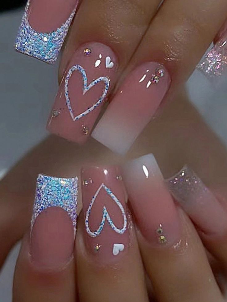 Charming Pastel Pink Nail Design with Glitter Tips and Heart Motifs for a Romantic Aesthetic