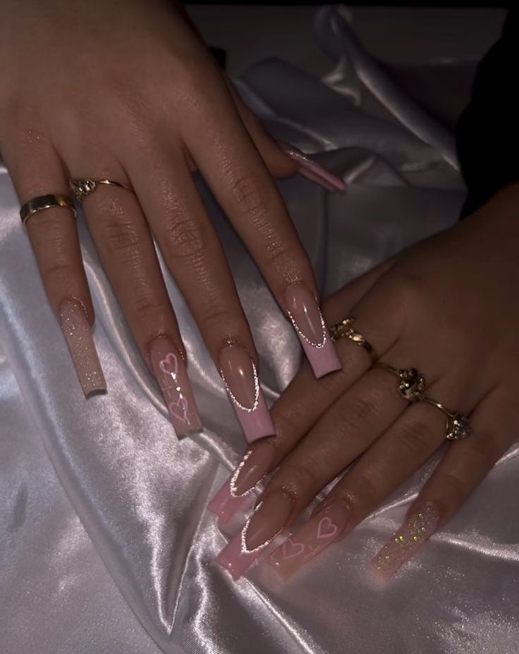 Sophisticated Romantic Nail Design with Pink Glitter Ombre and Chic Gold Accents.