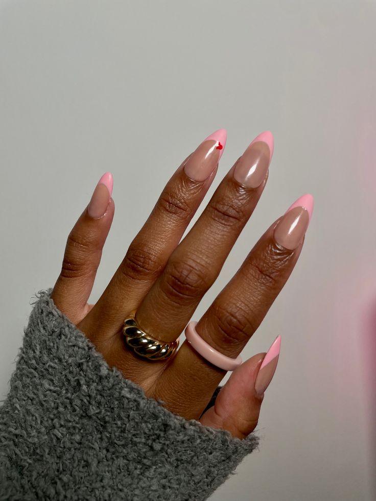 Chic French Manicure: Nude Base with Soft Pink Tips and Playful Red Heart Accent