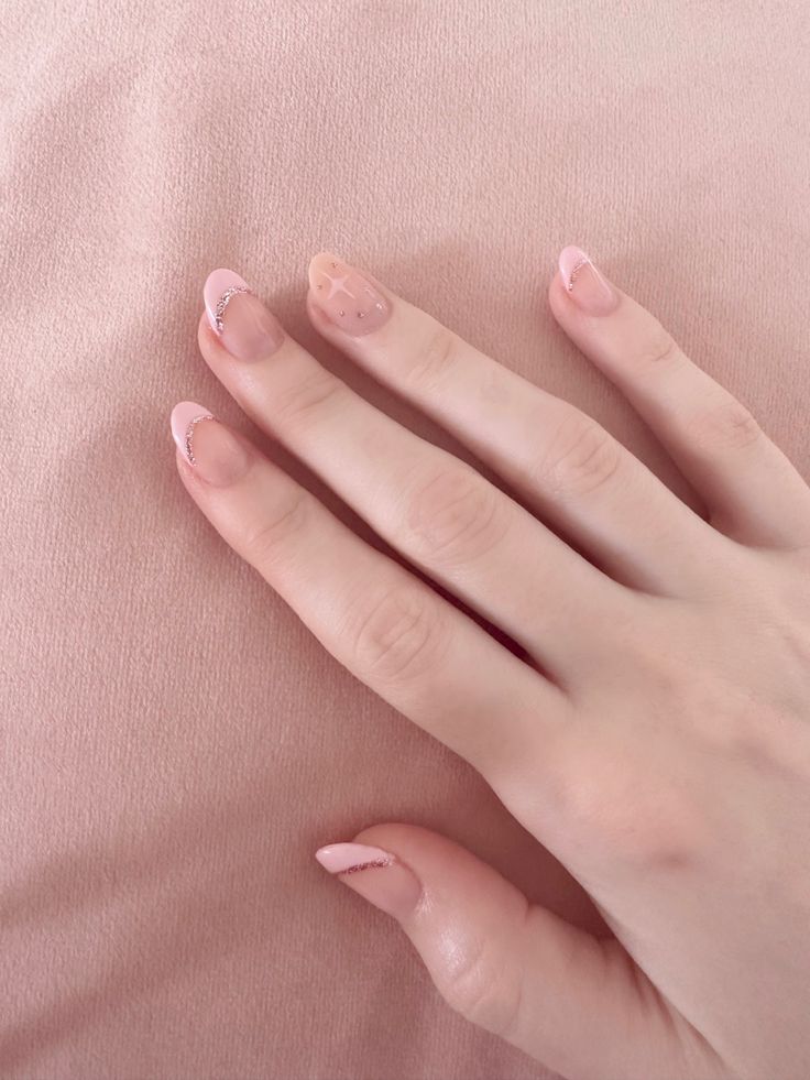 Elegant Soft Pink Nail Design with Geometric Accents and Shimmering French Tips.