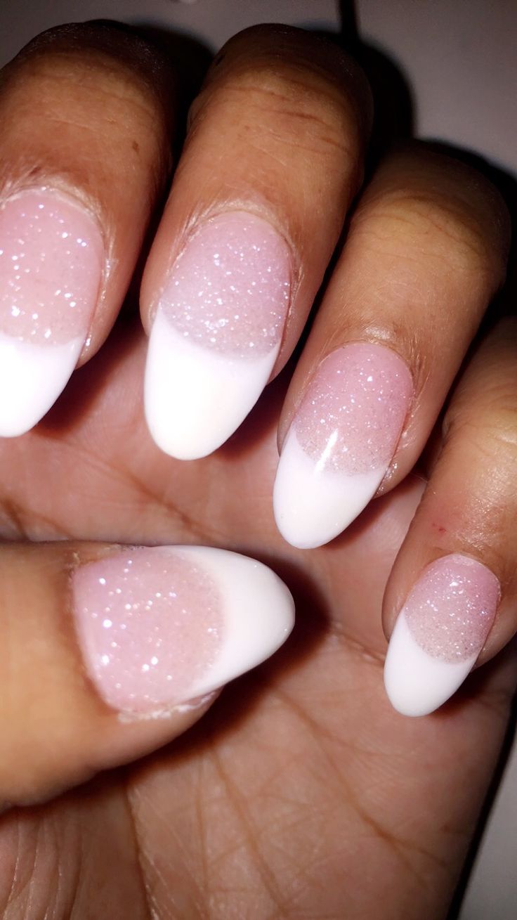 Elegant Pink and White Nail Design with Glitter and Classic Tips.