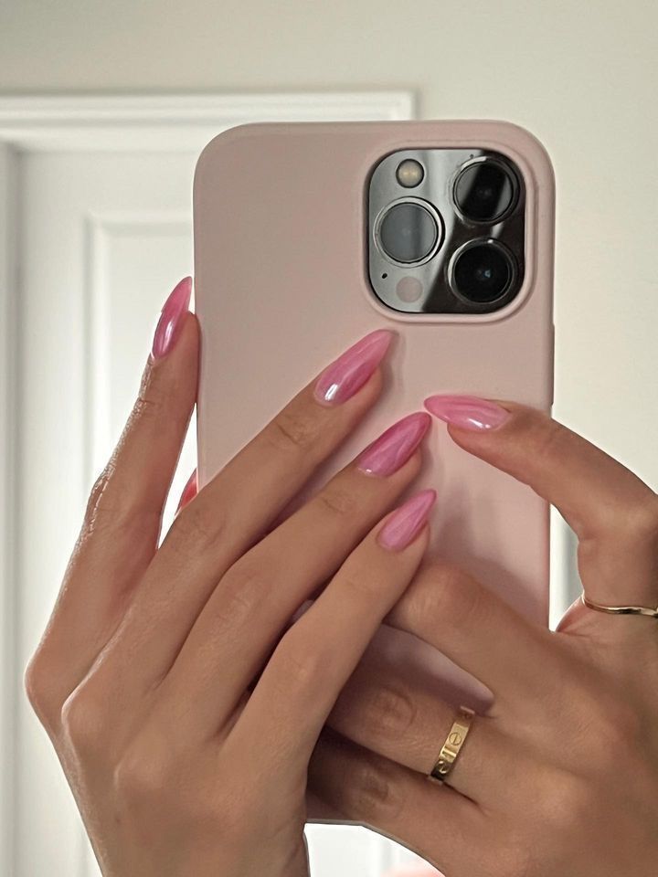 Chic and Polished: Elegant Pink Nails with Glossy Finish and Tapered Shape