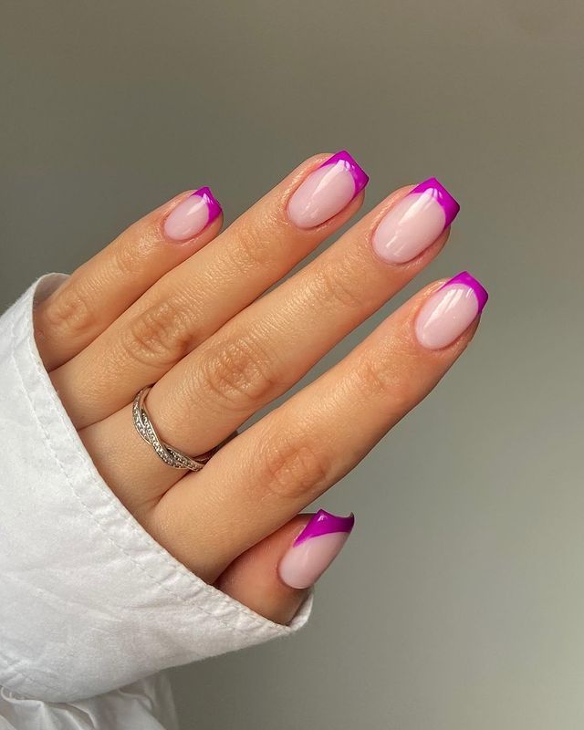 Chic and Fun: Modern French Manicure with Soft Pink Base and Vibrant Purple Tips.