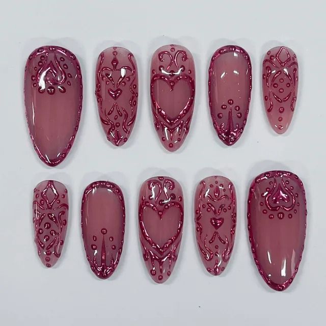 Romantic Soft Pink Nails with Intricate Burgundy Patterns for Any Occasion.