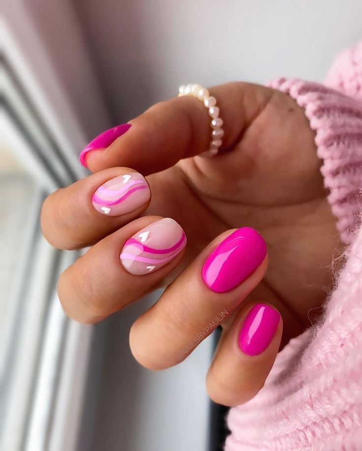 Chic Vibrant Pink Nail Design with Glossy Fuchsia and Marbled Accents.