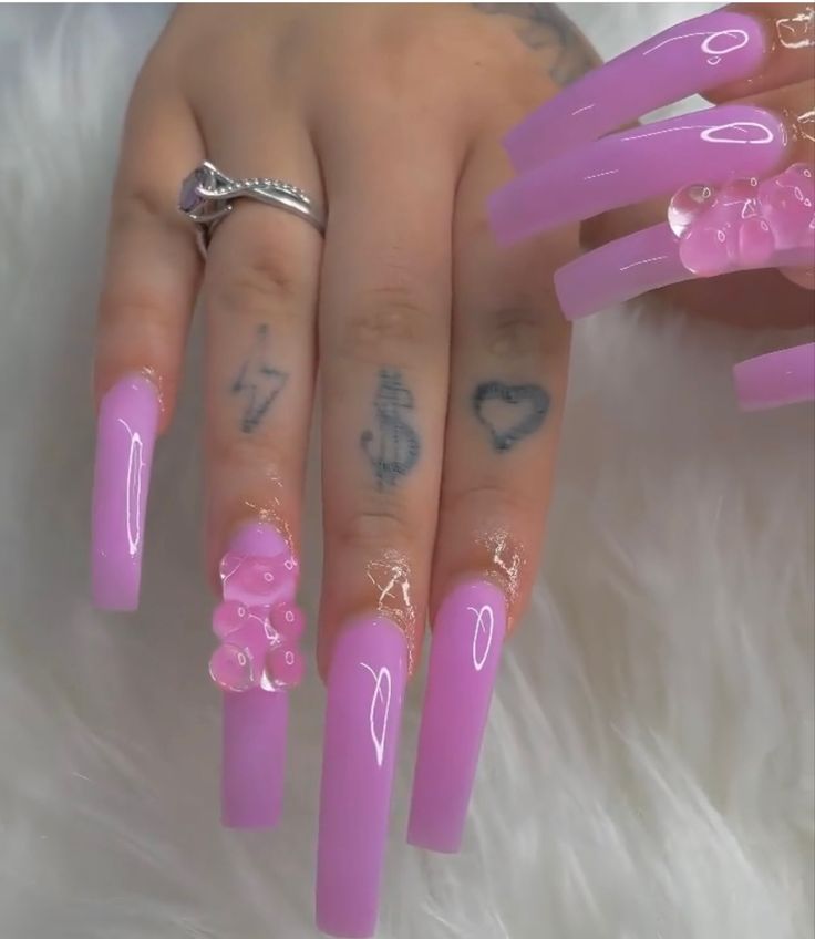 Chic Pink Glossy Long Nails with Unique Bubble Embellishments for a Bold Statement.