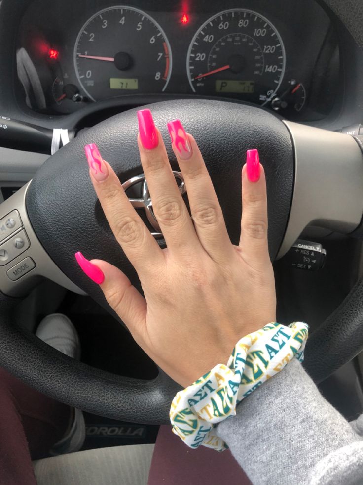 Bold Vibrant Pink Nail Design with Artistic Flame Patterns for a Statement Look.