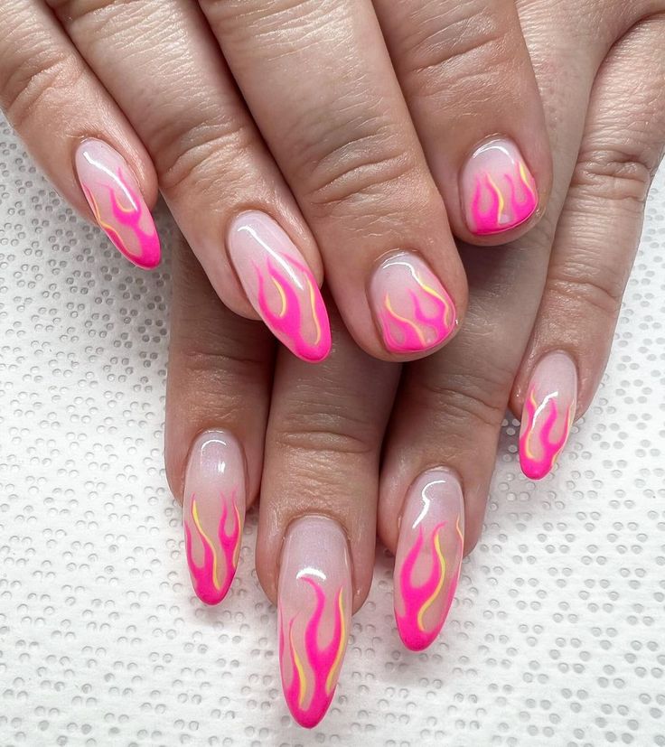 Bold Flame-Inspired Nail Design with Pink Gradient and Nude Base.