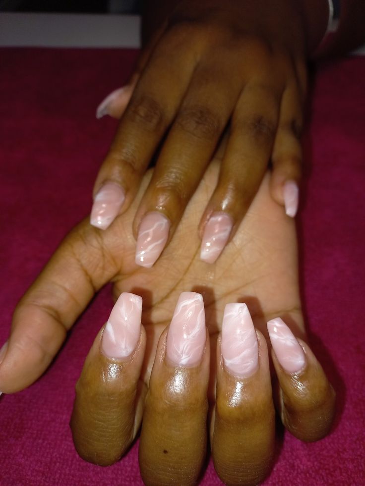 Sophisticated Soft Pink Nail Design with Glossy Finish and Unique Swirled Pattern.