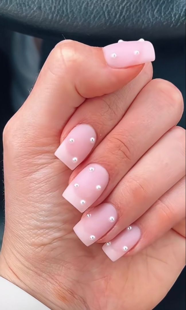 Sophisticated Soft Pink Matte Nail Design with Pearl Accents for Versatile Elegance.