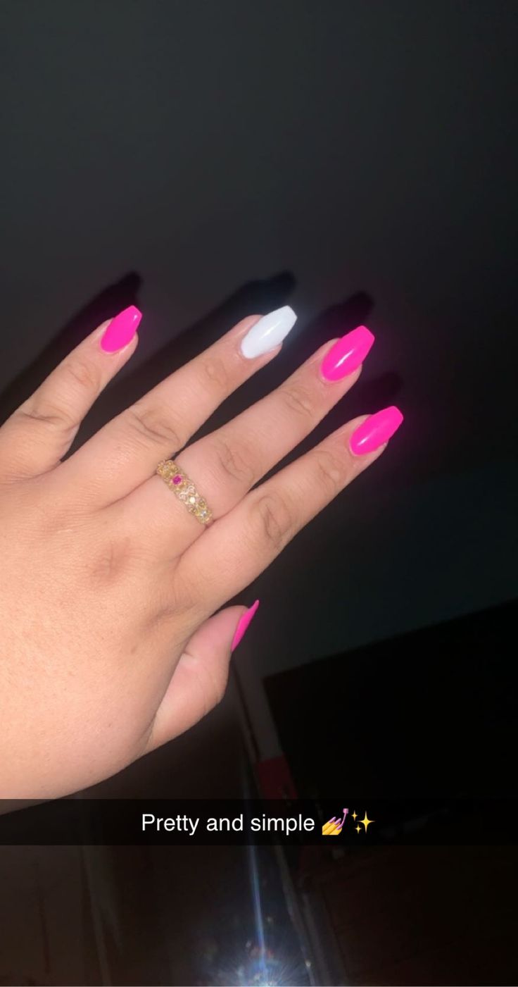 Playful Neon Pink Nail Design with Elegant White Accent and Gold Ring.