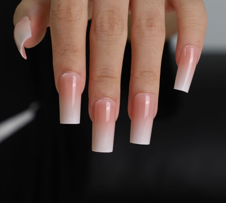 Elegant Ombre Nails: A Sophisticated Gradient from Light Pink to White for Any Occasion.