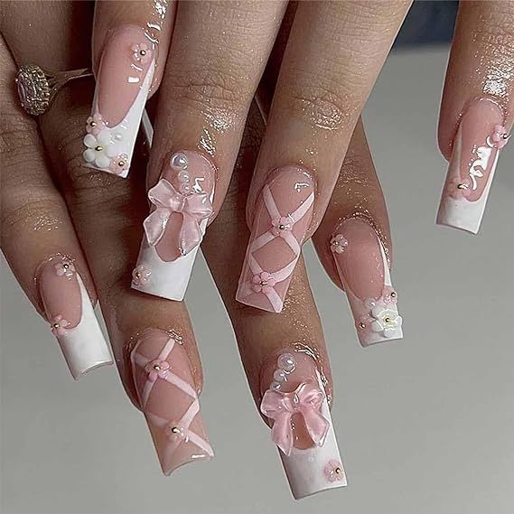 Charming Elegant Nail Design with Soft Pink and White Tones, Intricate Bows, and Floral Embellishments.