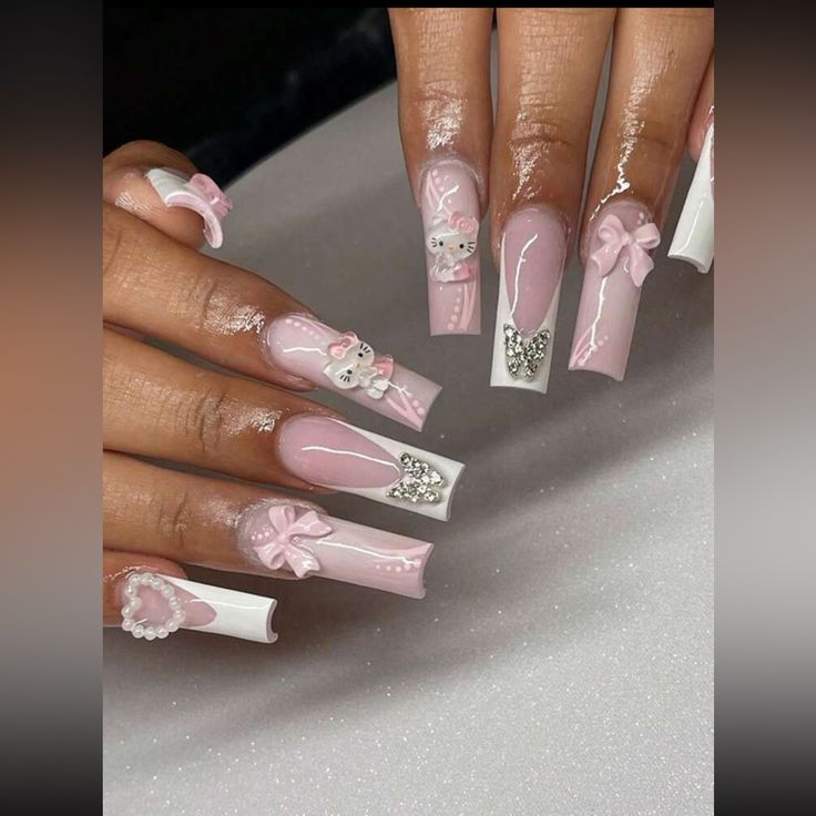 Elegant and Playful Nail Design in Soft Pink and White with Bows, Characters, and Rhinestones.