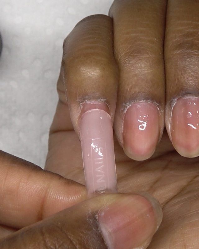 Elegant Pink Nail Tip Enhancement for a Cohesive and Understated Look.