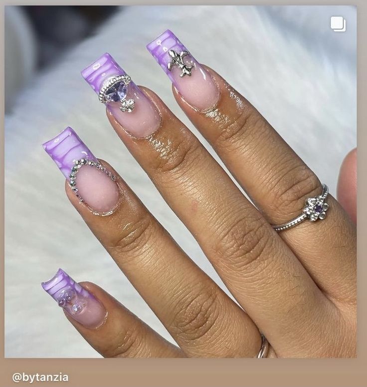 Elegant Lavender French Tip Nails with Marbled Effect and Embellishments