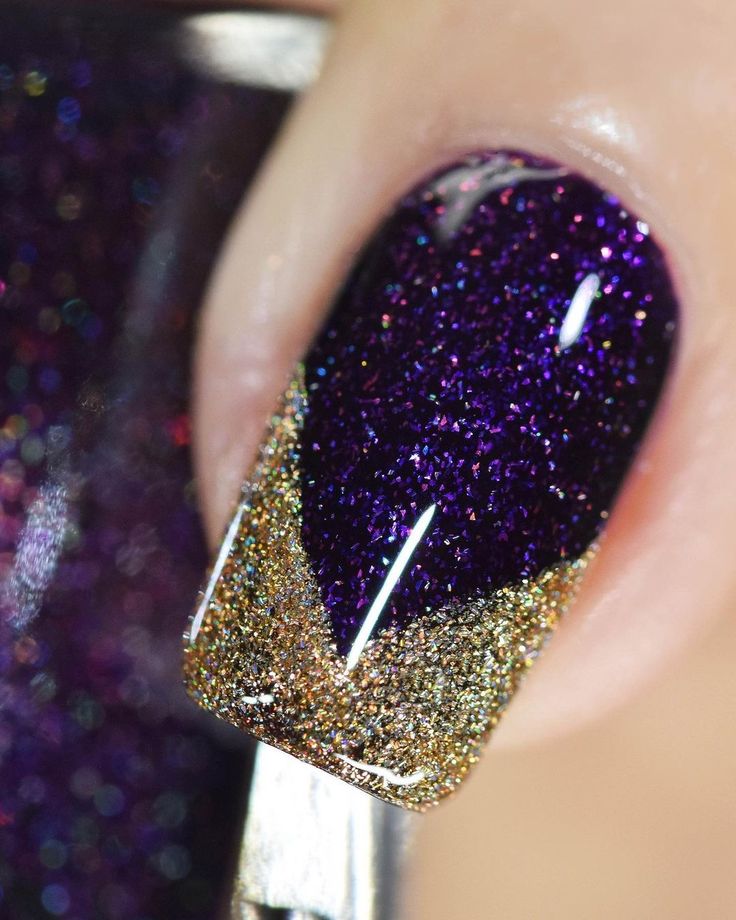 Elegant Sparkling Ombre Nail Design: Deep Purple Base with Glittery Gold Tips.